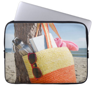 Bag Hanging On Tree Trunk At Sandy Beach