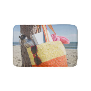 Bag Hanging On Tree Trunk At Sandy Beach Bath Mat