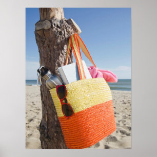Bag Hanging On Tree Trunk At Sandy Beach Poster