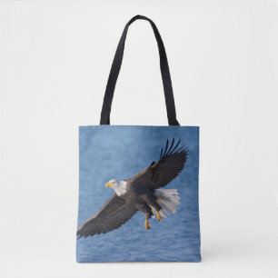 Bald eagle in flight tote bag
