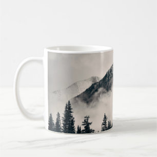 Banff national park foggy mountains and forest in  coffee mug