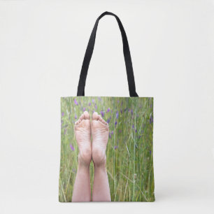 bare feet in meadow wildflowers tote bag