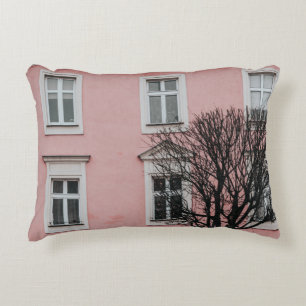 BARE TREE IN FRONT OF PINK BUILDING DECORATIVE CUSHION