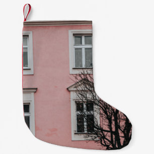 BARE TREE IN FRONT OF PINK BUILDING SMALL CHRISTMAS STOCKING