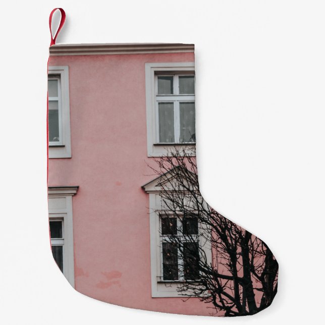 BARE TREE IN FRONT OF PINK BUILDING SMALL CHRISTMAS STOCKING (Front)