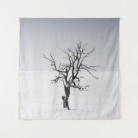 BARE TREE IN THE MIDDLE OF SNOW