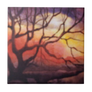Bare winter tree and dramatic fiery sunset ceramic tile
