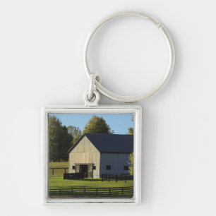 Barn on thoroughbred horse farm at sunrise, key ring