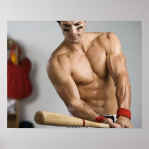 Baseball player with bare chest warming up with poster