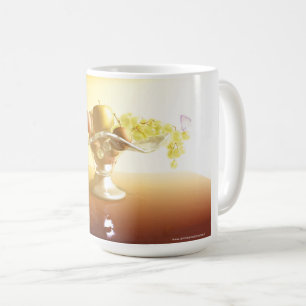 Basket of glass with fruits and batterfly coffee mug