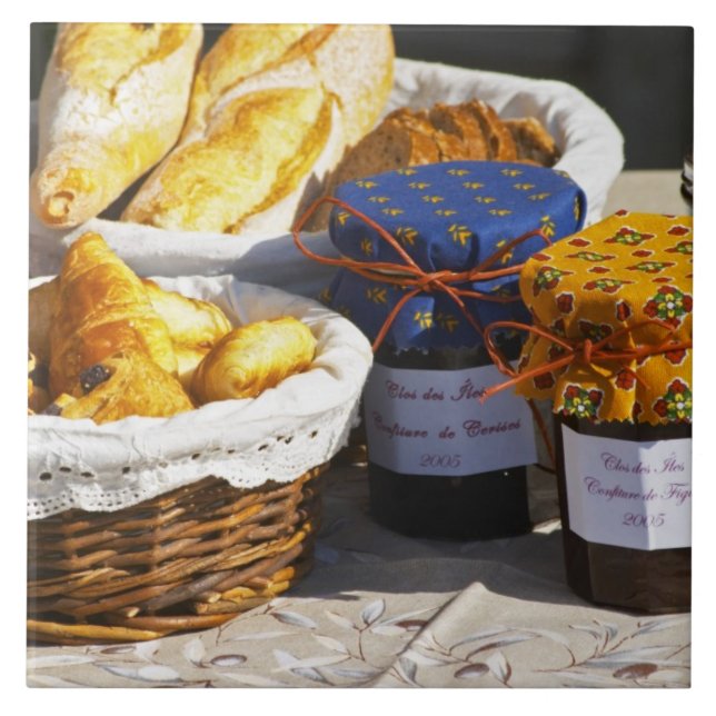 Basket with croissants and chocolate breads. ceramic tile (Front)