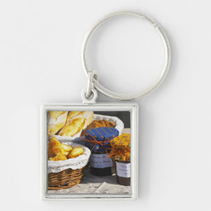 Basket with croissants and chocolate breads. key ring