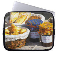 Basket with croissants and chocolate breads.