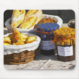 Basket with croissants and chocolate breads. mouse pad