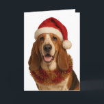 Basset Hound in a Santa hat Christmas card<br><div class="desc">Basset Hound looking very handsome sporting a Santa hat,  adorned in tinsel and looking very chuffed that it's Christmas!

Why not wish a lucky someone a Happy Christmas with this Basset Hound Christmas card.

You can personalize the text to your heart's content!

Also available as an instant download.</div>