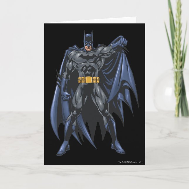 Batman holds up cape card (Front)
