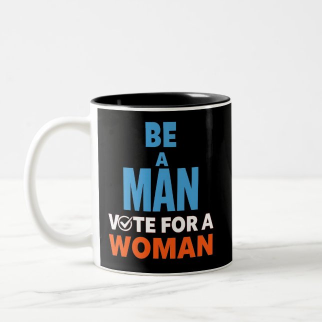 Be A Man Vote For A Woman Election Democrat Two-Tone Coffee Mug (Left)