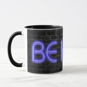 BE KIND text in neon lights on brick Mug