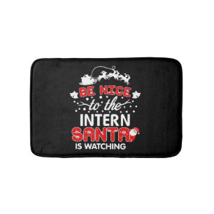 Be Nice To The Intern Santa Is Watching T-Shirt Bath Mat