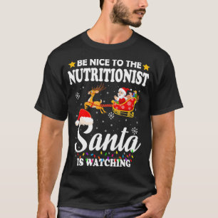 Be Nice To The Nutritionist Santa Watching Xmas  T-Shirt