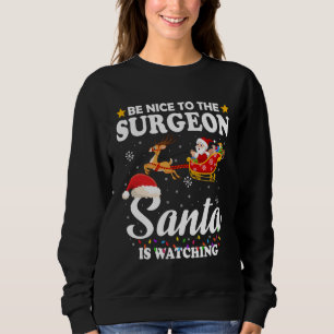 Be Nice To The Surgeon Santa Watching Xmas Sweatshirt