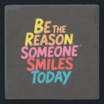 Be the Reason Someone Smiles Today (2) Stone Coaster<br><div class="desc">Brighten someone’s day with this cheerful and uplifting coaster featuring the inspiring phrase “Be the Reason Someone Smiles Today” in vibrant, colourful lettering. Whether you're gifting it to a friend or using it as a daily reminder to lead with kindness, this design delivers a message of encouragement, joy, and good...</div>