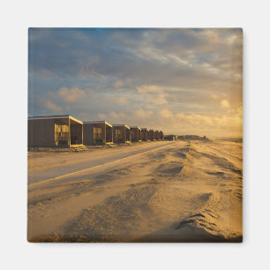Beach cabins at sunset at the dutch coast magnet