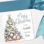 Beach Christmas Gift Tag Sticker<br><div class="desc">Tropical Shell Beach Christmas Tree Gift Tag. Add a warm and coastal touch to your holiday wrapping with this square Christmas gift tag featuring a watercolor Christmas tree made of beach shells, starfish, and coral. The tree is placed on the left side of the tag, resting in soft sand with...</div>