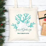 Beach Christmas Sand Dollar Starfish Aqua Blue  Tote Bag<br><div class="desc">Personalise this beach Christmas tote bag with aqua blue glitter coral,  white sand dollar and starfish,  and the holiday message “Seas & Greetings”.
*If you would like this design on more products or need design help,  please contact me through Zazzle Chat.</div>