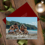 Beach Family Photo Peace On earth Christmas Holiday Card<br><div class="desc">Send warm holiday wishes with a peace on earth family photo Christmas card. This family beach fun photo card captures joyful moments by the ocean, perfect for an elegant beach photo Christmas card. Share your love with a merry Christmas message, creating a cute family photo Christmas card to cherish all...</div>