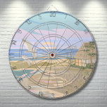 Beach House Dartboard<br><div class="desc">Transport yourself to the serene coastal bliss of a summer's day with this art print dart board, capturing the essence of a tranquil beach scene. The soft pastel hues of blue, pink, purple, tan and creams, evoke the calming aura of a coastal sunset or sunrise, where the ocean's gentle surf...</div>