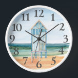 Beach Hut Ocean Watercolor Clock<br><div class="desc">A cute watercolor beach hut with sand and ocean white framed clock. Whimsical style for a beach house or for coastal design home decor.</div>