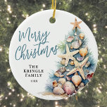 Beach Merry Christmas Ceramic Ornament<br><div class="desc">Celebrate the season with this festive and beachy round Christmas ornament, perfect for a coastal holiday celebration. The design features a whimsical Christmas tree made of beach shells, starfish, and coral, bringing a fun tropical touch to your holiday decor. The colour palette includes soft teal blue and tan tones for...</div>