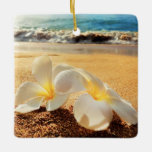 Beach Plumeria Christmas Ornament<br><div class="desc">Bring a lot more holiday cheer to your tree with our custom ceramic ornament. Add family photos, images and personal message to both sides of this ornament. A strand of gold thread makes it easy to hang this fantastic keepsake. Dimensions: 2.75"l x 2.75"w; Weight: 0.96 oz. Made of white porcelain...</div>