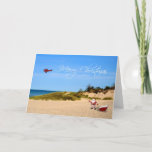 Beach Santa Greeting Card<br><div class="desc">A whimsical Christmas greeting with Santa and his sled on the beach with skywriting plane flying a Merry Christmas message.</div>