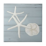 Beach Starfish Sanddollar Shells Dusty Blue Wood Ceramic Tile<br><div class="desc">Simple, tranquil seashore inspired design is perfect for a modern stylish beach house or a Cottage style home at the shore. Hand painted oil pastel White Fingered Starfish and sun bleached sand dollar seashells with elegant, painterly detail was created by internationally licensed artist and designer, Audrey Jeanne Roberts. Cottage dusty...</div>