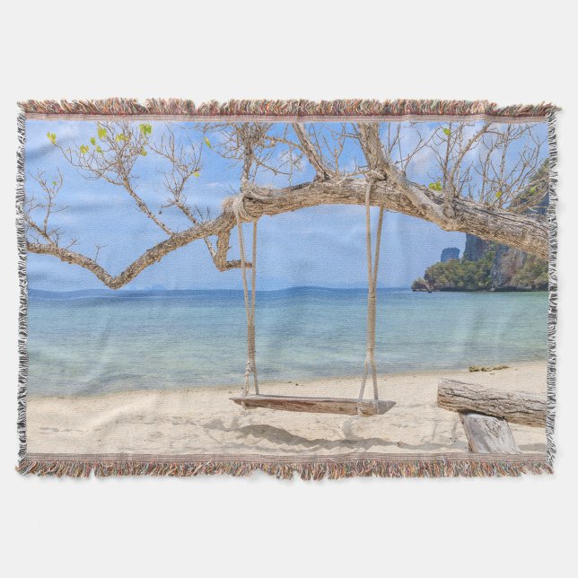 Beach Swing Throw Blanket (A picturesque beach scene featuring a rustic wooden swing hanging from a sturdy tree branch.)