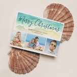 Beach Vacation Merry Christmas Photo Holiday Card<br><div class="desc">Send warm season's greetings with this beach-themed Christmas card. The coastal holiday photo cards features a sea green watercolor wave upon a sandy shore. Script lettering atop the wave reads "Merry Christmas" in a pretty blue-green ocean colour. Three photos are placed below the painted wave. To personalise, add your names...</div>