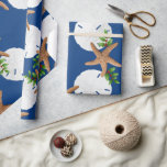 Beach Wreath Large Pattern Christmas Wrapping Paper<br><div class="desc">Quality Christmas wrapping paper on a roll with starfish and sand dollars "beach wreath" design. This large image is printed over an navy blue background colour, with seashells and holly in brown, white and green making a circular wreath pattern. If you don't see a background colour you like, you may...</div>