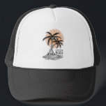 Beachlife Trucker Hat<br><div class="desc">Embrace the ultimate vacation vibes with this 'Life’s a Beach' graphic design. Featuring a classic illustration of two palm trees on a small island set against a stylized orange sun, this design captures the essence of a tropical paradise. Its minimalist black line art combined with a pop of sunset orange...</div>