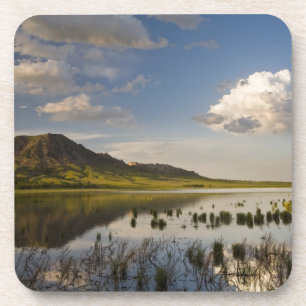 Bear Butte reflects into Bear Butte Lake near Coaster