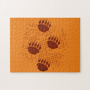 Bear Cub Paw Prints On Distressed Background Jigsaw Puzzle