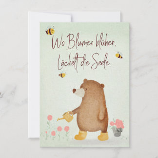 Bear pours flowers in the garden in rubber boots