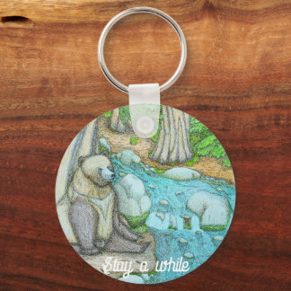 Bear sitting by a creek key ring