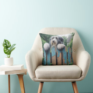 Bearded Collie Peeking Over an Old Fence Cushion