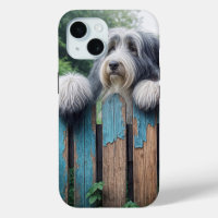 Bearded Collie Peeking Over Old Fence