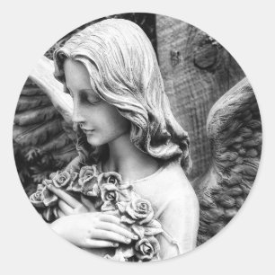 Beautiful angel holding roses on her chest classic round sticker