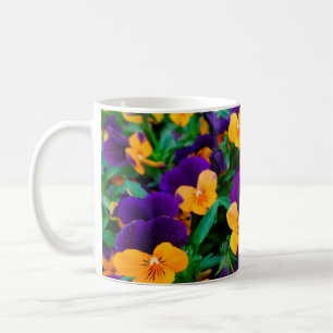 Beautiful blooming pansies in the garden coffee mug