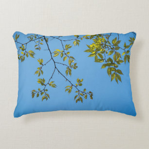 beautiful branch with green and yellow leaves hug decorative cushion