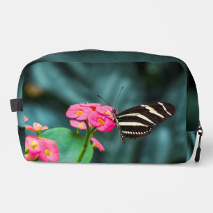 Beautiful butterfly on a pink flower dopp kit